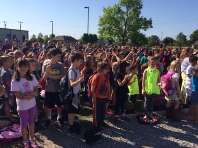 students surprised by new backpacks